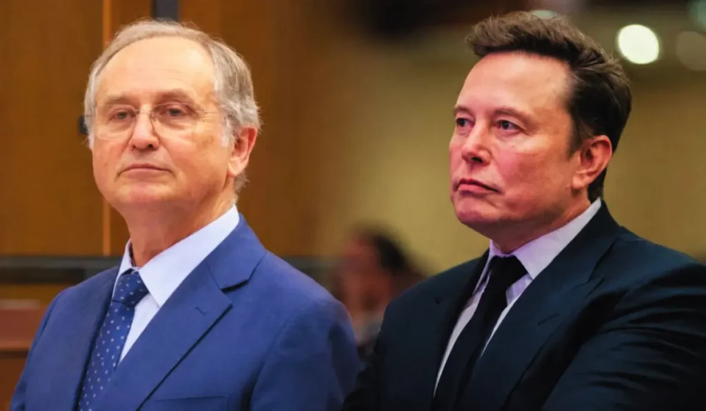 Elon Musk in primo piano durante una conferenza stampa sulla vicenda Roggero